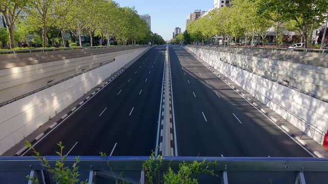 Paseo de la Castellana in Madrid in the tunnel of Plaza Castilla on a holiday without traffic, Spain