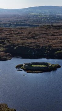 Aerial of the historic Ringfort at Lough Doon, Portnoo, County Donegal, Ireland