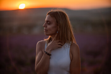 Woman sunset lavender field profile portrait contemplative mood golden hour © svetograph