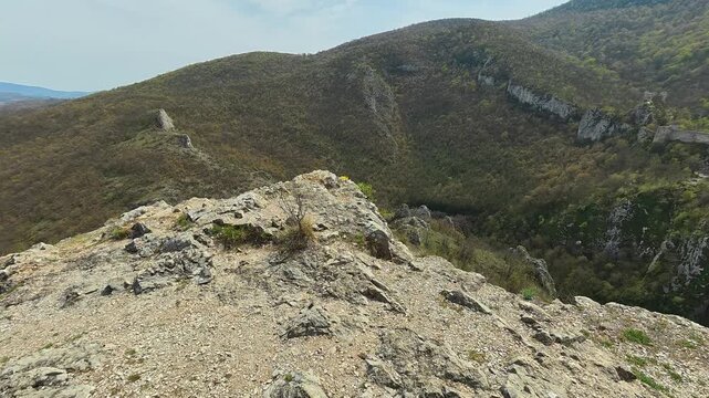 Rugged cliffs overlook rolling hills. Mount Ozren, Sokobanja, Serbia