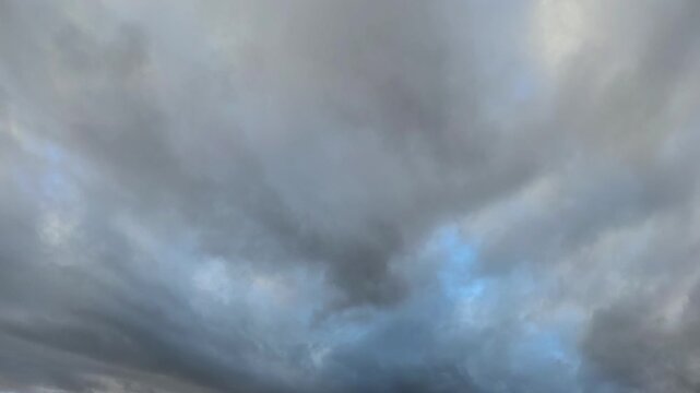 Amazing orange stratocumulus clouds moving in the sky