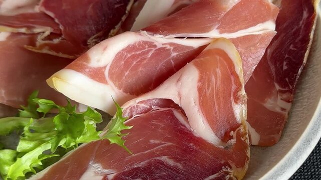 Jamоn exquisite cured meat sliced meat dish tasty snack fresh gourmet food background on the table, rustic food top view, copy space