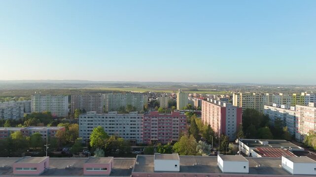 Panoramic backward drone spring flight over a spring urban landscape. panoramic view of a residential neighborhood. Numerous multi-story apartment blocks