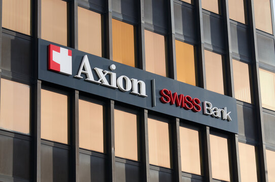 Axion Swiss Bank sign on building exterior in Lugano, Switzerland