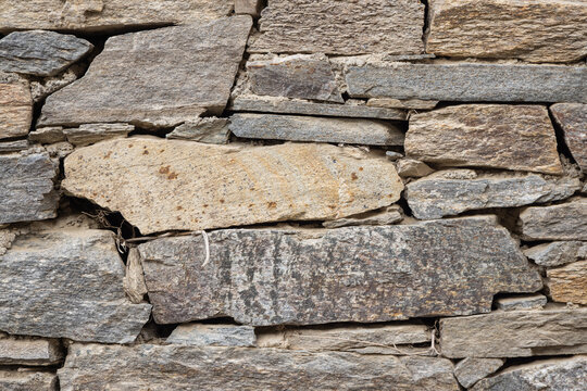 Patterns in a rough cut stone wall.