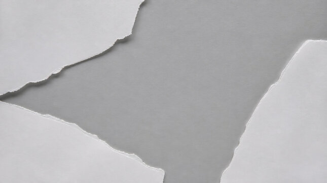 White torn paper pieces on grey background with copy space