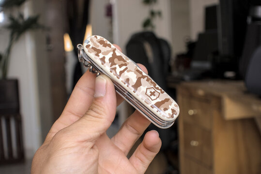 Zapopan Jalisco, Mexico - May 7, 2026:Victorinox Huntsman multi-tool with desert camouflage, victorinox knife concept