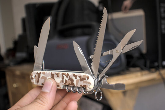 Zapopan Jalisco, Mexico - May 7, 2026:Victorinox Huntsman multi-tool with desert camouflage, victorinox knife concept