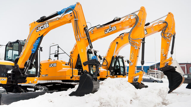 Riga, Latvia - February 7, 2026: New JCB excavators on the street near the auto center in winter
