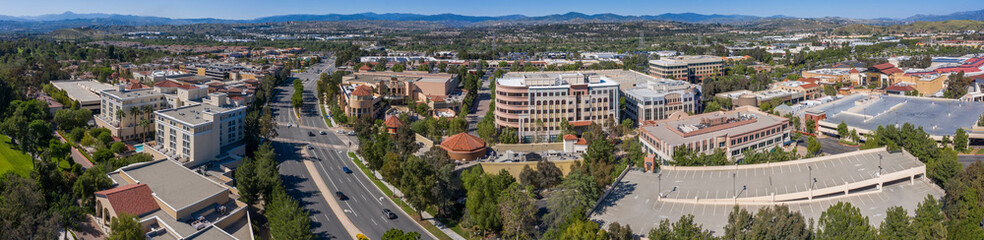 Fototapeta premium Panoramic afternoon aerial view of the downtown skyline buildings of Santa Clarita, California, USA.