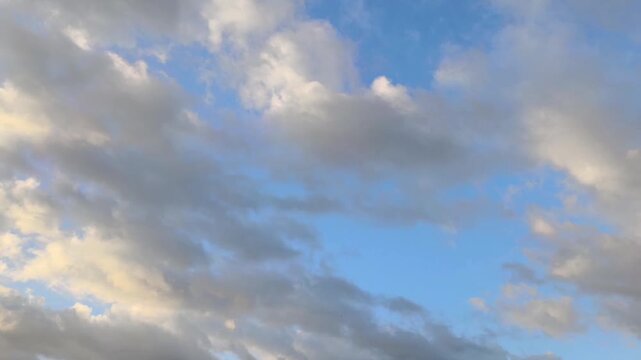 Orange stratocumulus clouds divide in other clouds
