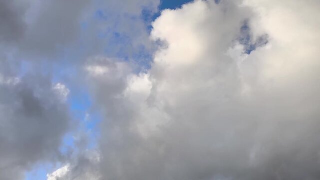 Orange stratocumulus clouds moving late in the day