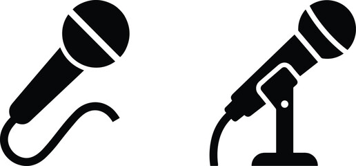 Minimalist black microphone icon set featuring a handheld vocal mic with cable and a professional stage mic on a desktop stand © Antara