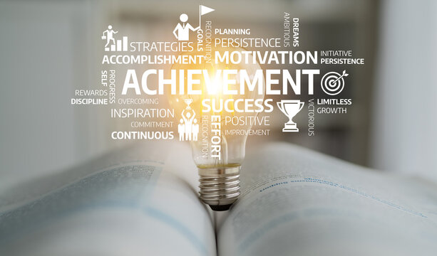 A glowing light bulb emerges from an open book, surrounded by inspiring words symbolizing achievement, motivation, and personal growth. Perfect for themes of success. Tessel