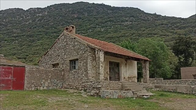 Traditional Mediterranean stone house in mountains.