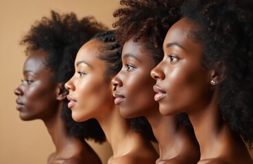 Obraz premium Four diverse women in profile view showcasing different skin tones and natural hairstyles. Their faces express confidence and beauty, representing unity and individuality in a studio setting.
