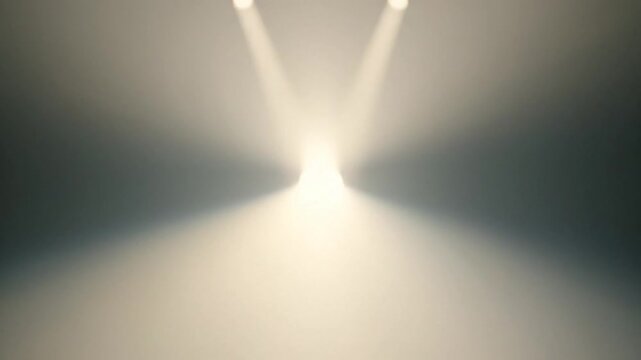 Stage spotlight illuminating a dark empty space with dramatic lighting effects and atmospheric haze