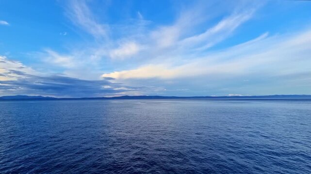 The calm water of the Adriatic Sea on beautiful Makarska riviera, Croatia, at morning, before sunrise