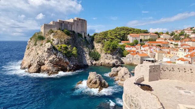 The historic Fort Lovrijenac on a rocky cliff and the blue Adriatic Sea in old town of Dubrovnik, Croatia, on a sunny day