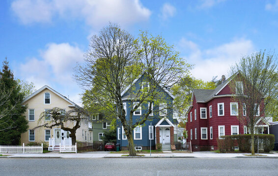 Street of typical New England houses with colorfully painted clapboard