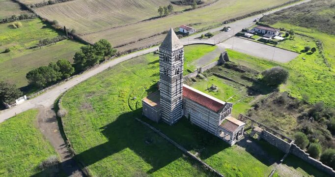 The Basilica della Santissima Trinita di Saccargia (Basilica of the Holy Trinity), a romanesque church in northern Sardinia, Italy. Entirely built with local black basalt and limestone.