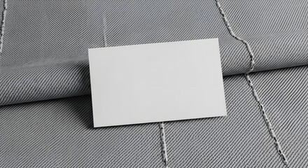 Fototapeta premium Blank Business Card on Elegant Gray Textured Fabric Background