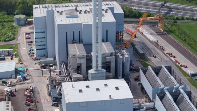 Aerial view of Enfinium 1 and 2 Ferrybridge energy from waste facility with industrial chimneys and complex piping in Knottingley, England, United Kingdom.