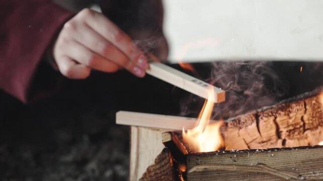 Burning Firewood with Flames and Smoke in Outdoor Setting