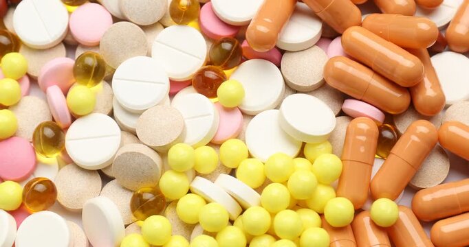 Many different pills as background, top view