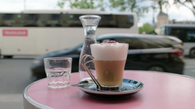 Typical French cafe culture experience with coffee and water on a terrace