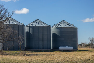 Metal Grain Silos on Rural Farm © JackCA