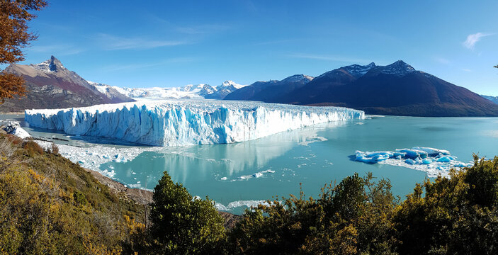 Majestic Perito Moreno Glacier face reflecting in Lake Argentino, Patagonia.
