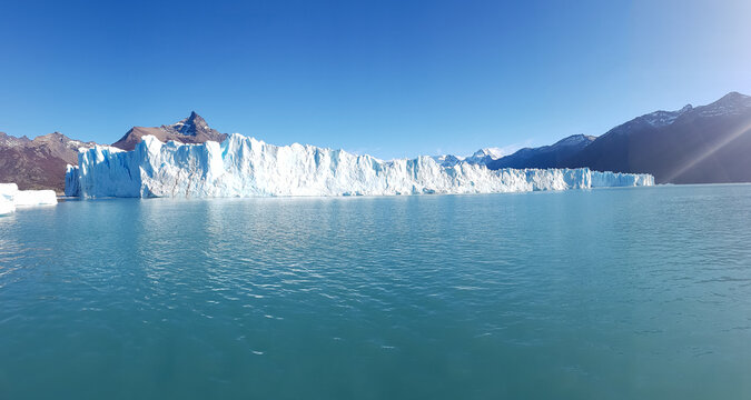 Perito Moreno Glacier in Patagonia Argentina with turquoise lake and blue sky