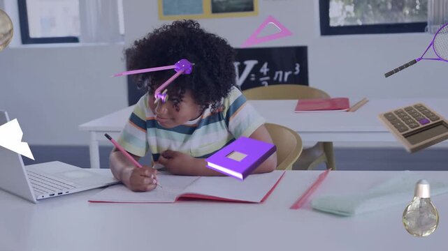 Male student leaning, writing at desk, causing purple icons orbiting laptop notebook while studying