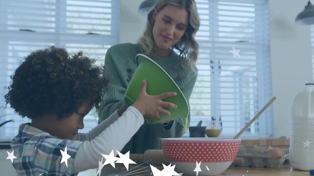 Mom guiding son tilting green bowl pouring baking batter into red polka-dot bowl, stars popping