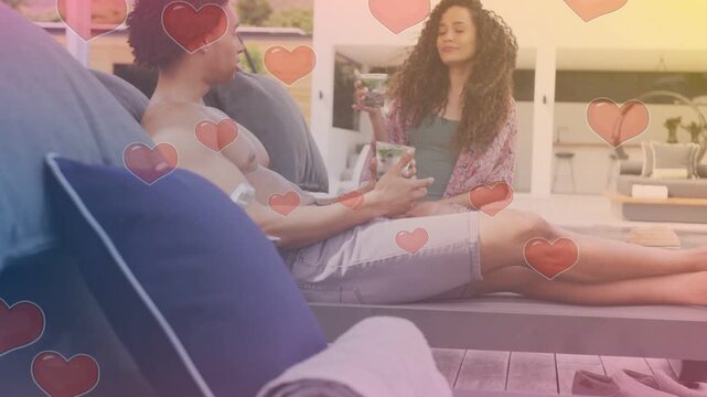 Man giving cup woman lifting glass cam pullback showing hearts overlay over couple relaxing for ads