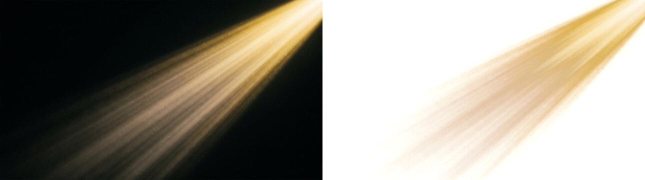 Golden spotlight beam with dust particles isolated on transparent background and black background cinematic light rays effect for stage or sunbeam flare overlay