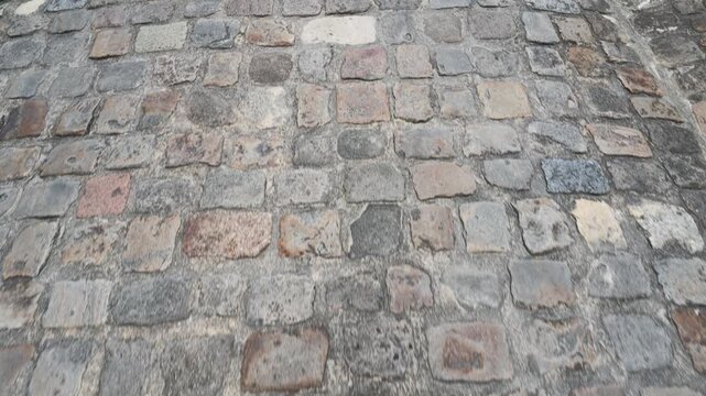 Close Up Tracking Shot of Vintage Cobblestone Street in Saint Emilion
