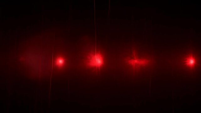 Red black grunge horror creepy abstract light glow with dark background, eerie haze, shadowed mist, and glowing red points creating dramatic blur atmosphere