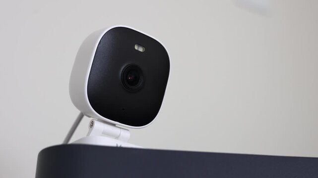 Discreet Security Camera Perched Above.