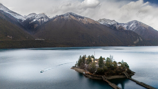 Buddhist Monastery Reflected in Alpine Lake, Tibet, China