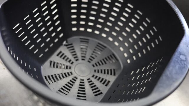 Spaghetti Pasta Into Strainer With Steam Billowing