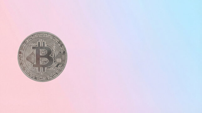 Silver bitcoin coin on soft pink blue gradient background with wide copy space concept for digital currency investing blockchain finance online payment technology market volatility secure assets