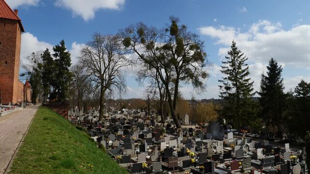 The Parish cemetery and Chelmno walls on Easter week. Poland.