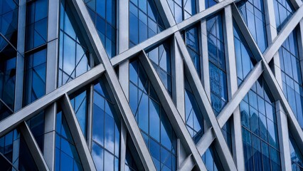 Obraz premium Modern Abstract Architectural Facade with Blue Glass and Steel Geometric Framework
