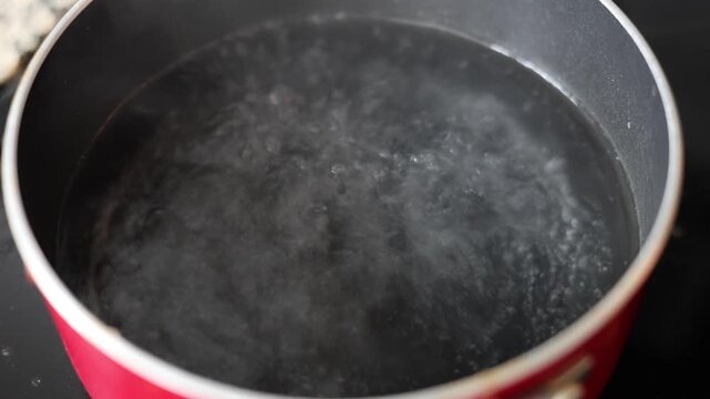 Angel Hair Pasta Tossed Into A Pot Of Boiling Water