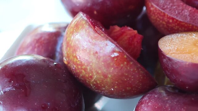Fresh, yellow-red mountain cherries on a container.