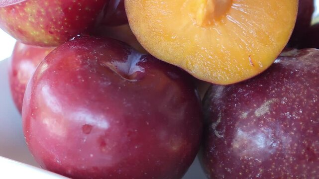 Fresh, yellow-red mountain cherries on a container.