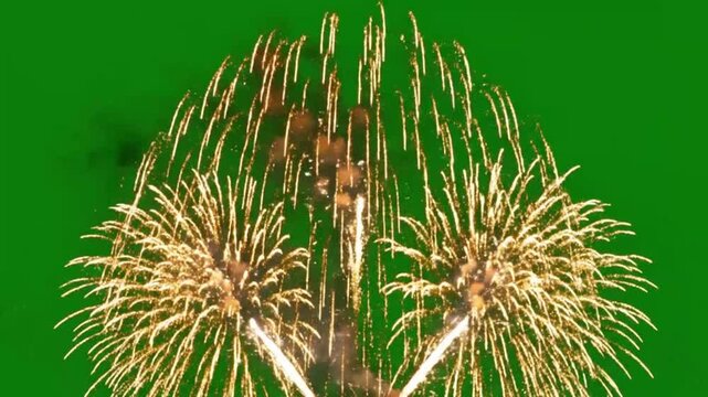 Golden fireworks exploding against green screen emphasizing fluid motion and vibrant color palettes