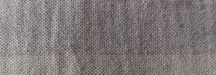 Fototapeta premium Natural linen fabric texture, coarse grey burlap material background, rustic woven textile surface for interior design and upholstery
